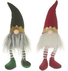 Luxurious green and red gonks with gold trim around their hats.