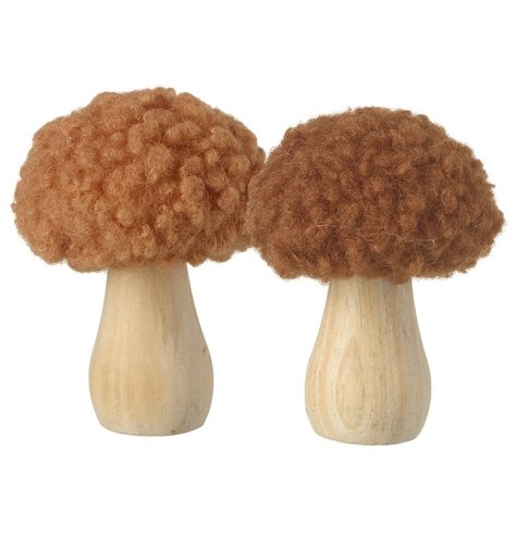 Two charming wooden mushrooms with sherpa tops in burnt orange.