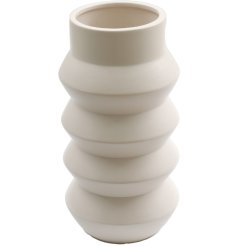 A chic contemporary vase with ribbed detailing. A unique sculptural vessel for flowers and foliage.
