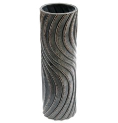 A stoneware vase with a tall thin design, crackled effect and 3D wave pattern detail.