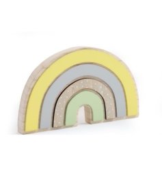 a wooden rainbow freestanding decoration in pastel colours and polkadots