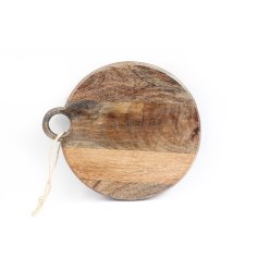 A rustic circular chopping or graze board with a natural wood grain and a beautifully crafted finish. 