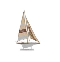 A decorative wooden sailing boat with fabric sails, rope details and "this way to the beach" design.