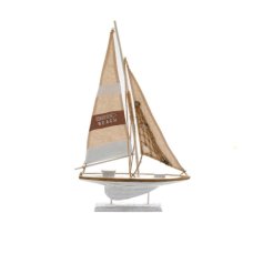 A decorative wooden sailing boat with fabric sails, rope details and "this way to the beach" design.