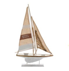 A natural wooden sailing boat decorative item with fabric sails with rope details.