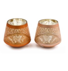A glass tea light holder with an intricate metallic pattern in a stylish burnt orange colour. 