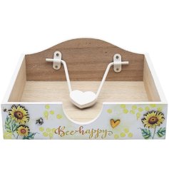 Decorated with beautiful sunflowers a wooden napkin holder.