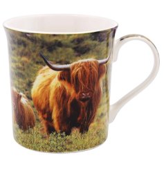A fine china mug featuring a highland cow and calf print within a beautiful countryside setting. 