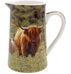 A ceramic jug featuring a highland cow and calf print within a beautiful countryside setting. 