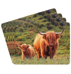 A set of 4 placemats featuring a highland cow and calf print within a beautiful countryside setting. 