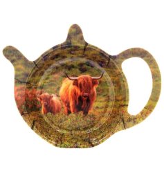 A tea bag tidy featuring a highland cow and calf print within a beautiful countryside setting. 