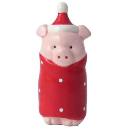 a festive ornament of a Christmas pig wrapped in a red blanket.