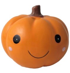 A cute ceramic pumpkin decoration with a cute painted face. 