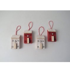 An assortment of 4 wooden house tree decorations in traditional red and white
