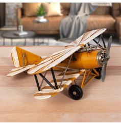 A metal plane decoration with striped design a vintage design with propeller. 