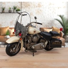 A metal police bike design decorative item with vintage effect rustic styling.