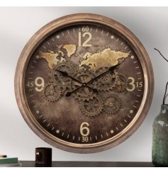 A large wall clock featuring a gold colour scheme with details including gold edging, numbers with cog detailing. 