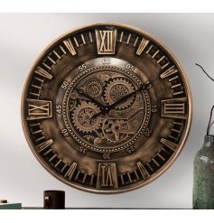 A beautiful large wall clock with a gold colour scheme and intricate cog detail design. 