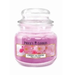 A lidded glass jar candle with a cherry blossom scent and pretty pink design. 