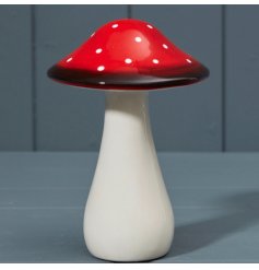 A chunky mushroom decoration painted in red with white polkadots.