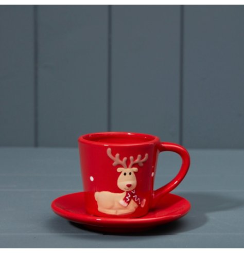 cute cup and saucer set with a charming reindeer, in a bold festive red colour