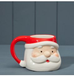 A Santa face mug with a glaze finish
