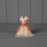 A standing mouse decoration wearing a faux fur skirt.