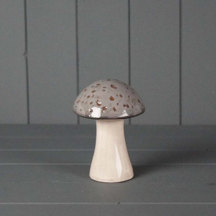 A rustic ceramic mushroom decoration in a earthy grey tone.