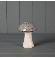 A natural grey ceramic mushroom decoration with a simple glazed finish
