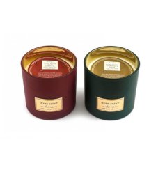An assortment of 2 luxury glass candle pots in earthy tones with a matte finish and glossy gold centre. 