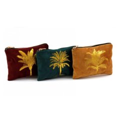 An assortment of 3 luxury bags in earthy colours, each with a gold embroidered palm design. 
