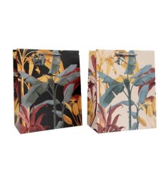 An assortment of 2 gift bags, each featuring a colourful tropical palm print design. 