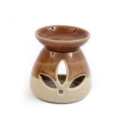 A beautiful oil burner in earthy natural colours. A two tone design with floral cut out and crackled finish.