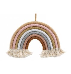 A beautifully crafted woven rainbow in earthy colours with fringing. 