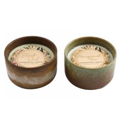 an assortment of 2 luxury scented candle pots in green and brown tones