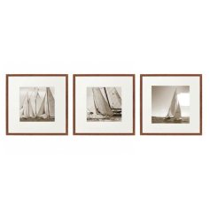 An assortment of 3 framed wall arts featuring sepia sailing boat imagery.