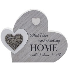 A plaque with "What I love most about my home is who I share it with" message
