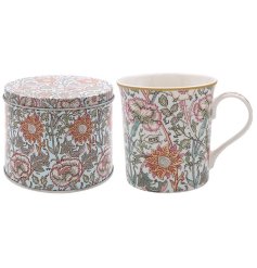 A ceramic mug featuring William Morris pink & rose pattern presented in a matching tin. 