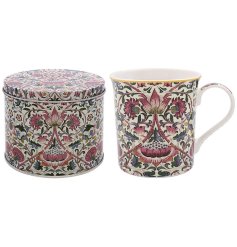 A ceramic mug with William Morris 'Lodden' pattern and gold rim detail, presented in a matching tin. 