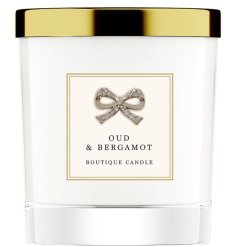 A chic candle pot filled with a beautiful home fragrance. A beautifully presented scented candle.
