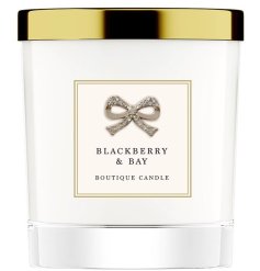 A richly scented candle with stunning gift packaging including a diamond bow and gold lid. 