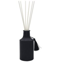 A contemporary and sleek black ribbed diffuser with tassel detail. 