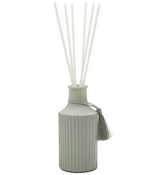 Bring the fresh scents of basil and mandarin into the home with this stylish sage green ribbed diffuser