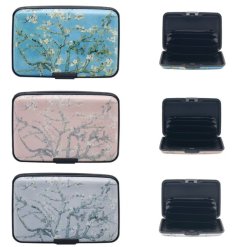 An assortment of 3 credit card protectors each featuring a floral blossom tree design with a colourful background. 
