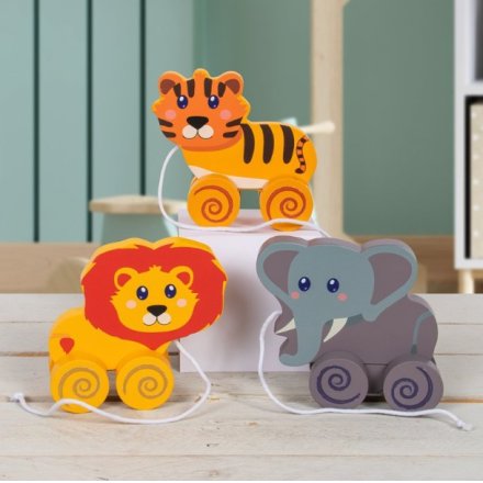A traditional wooden pull along toy. Three assorted as a lion, tiger and highland cow.