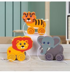 Traditional wooden pull along toy in the form of a colourful lion, tiger and elephant.