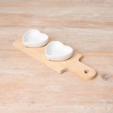 A wooden tray with 2 ceramic heart dishes