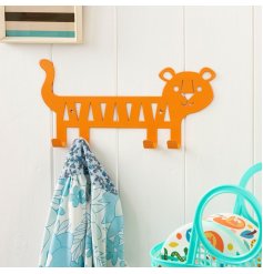 A simple orange clothes hook in the cut out shape of a tiger.