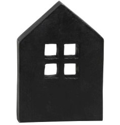 A chic and contemporary mango wood house ornament with a black finish. 