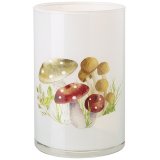 A chic opaque glass candle holder with a woodland mushroom motif.